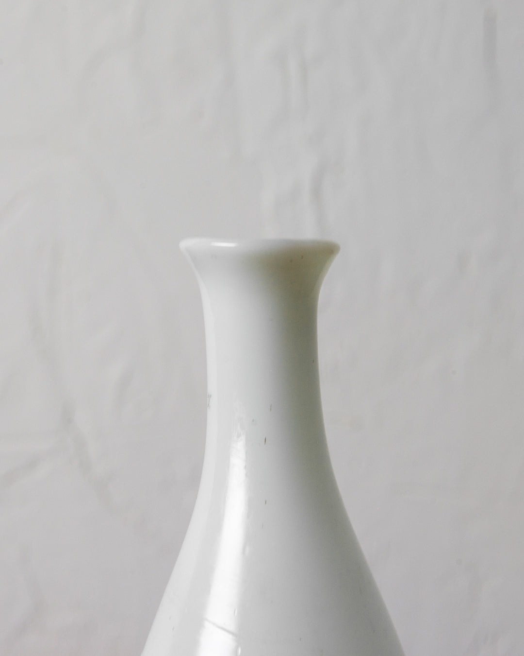 
                  
                    Small Old White Glass Bottle
                  
                